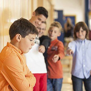 kids pointing and laughing bullying