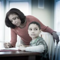 Mom helping child with homework